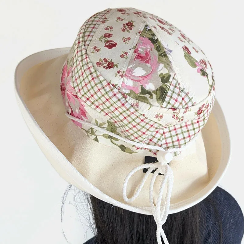 Sunblocker UV summer sun hat with wide brim, quilted one of a kind featuring reds and greens, adjustable fit