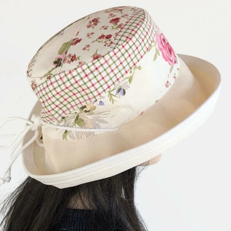 Sunblocker UV summer sun hat with wide brim, quilted one of a kind featuring reds and greens, adjustable fit